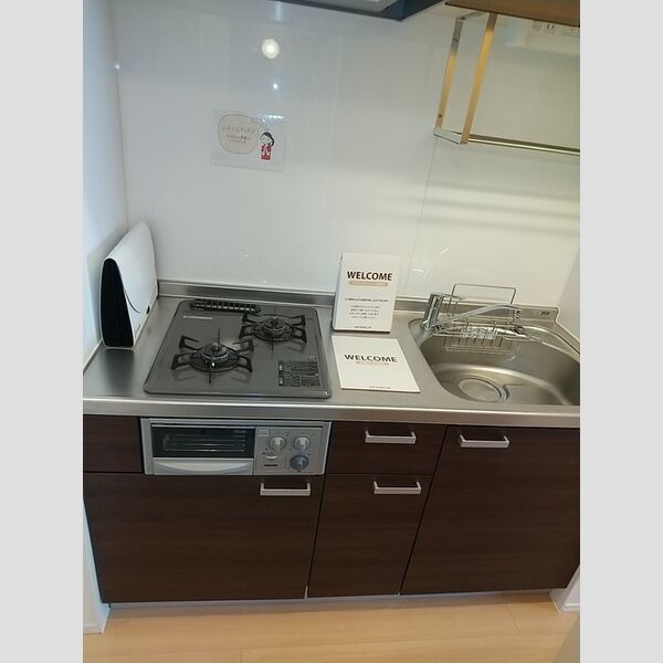 ロイヤルヒルズR107号室 グリル付きのキッチン