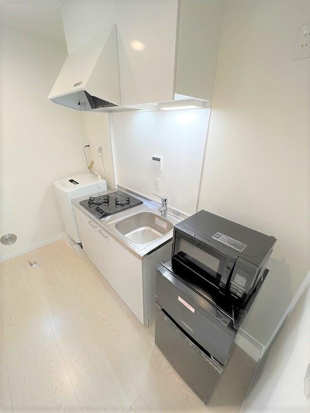 アトリアコートⅣ202号室 左右に洗濯機・冷蔵庫・電子レンジ