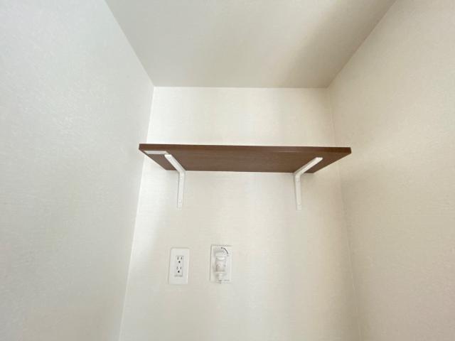 クレリア101号室 洗濯機上部棚