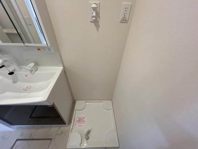 ユニヴェール102号室 洗濯機置場