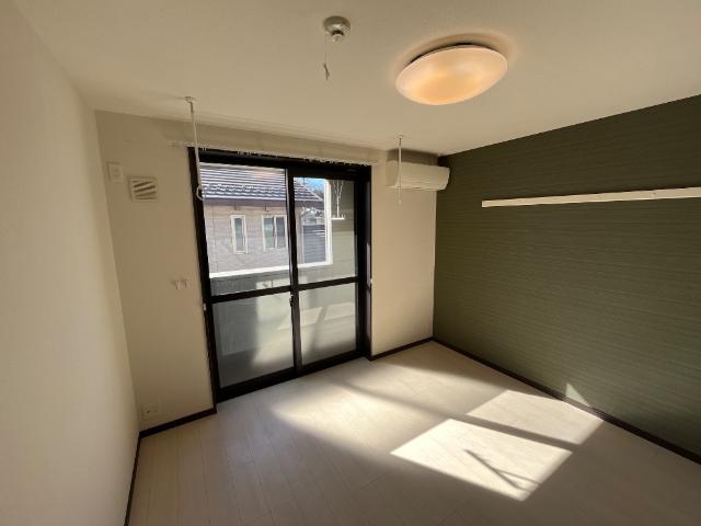 グランドロータス聖蹟202号室 洋室