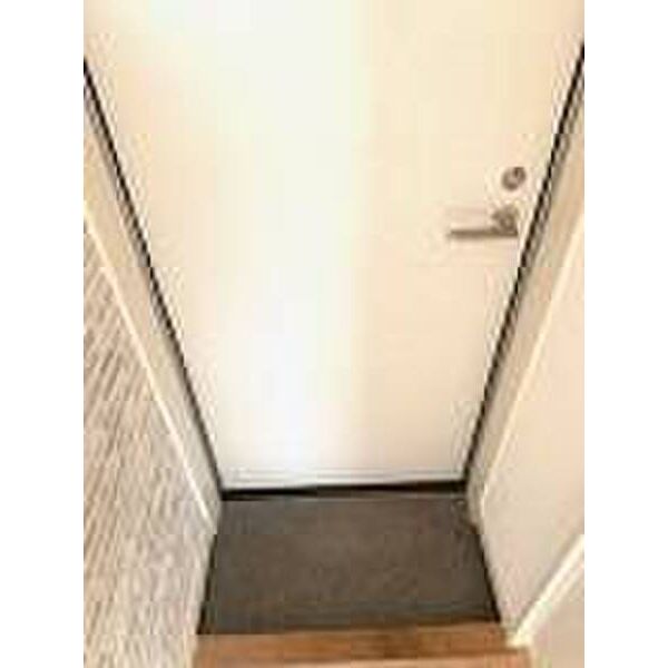 アルカンシェル薬園台0106号室 玄関