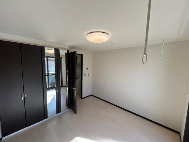 グランドロータス聖蹟202号室 洋室