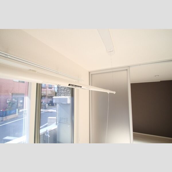 アナシエ鹿浜105号室 室内物干しざお