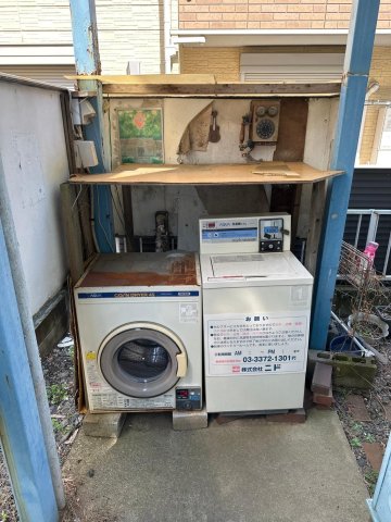 プラザ ドゥ グレンヂ203号室 コインランドリー