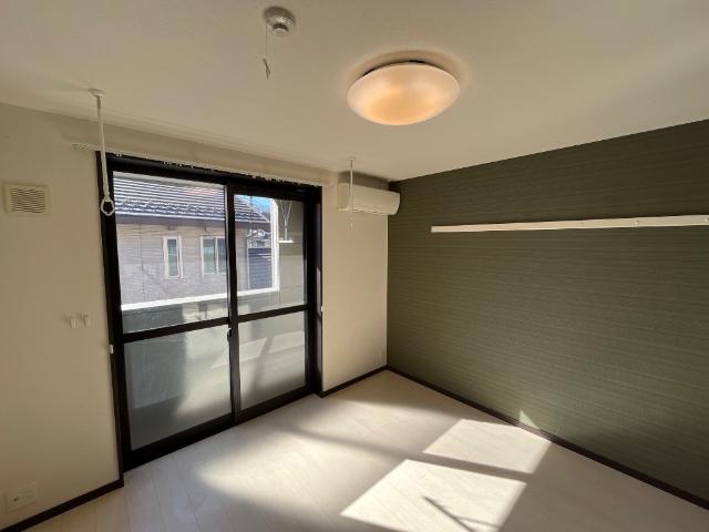 グランドロータス聖蹟202号室 洋室